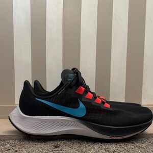 Nike Black Sneakers with Blue and Red Accents